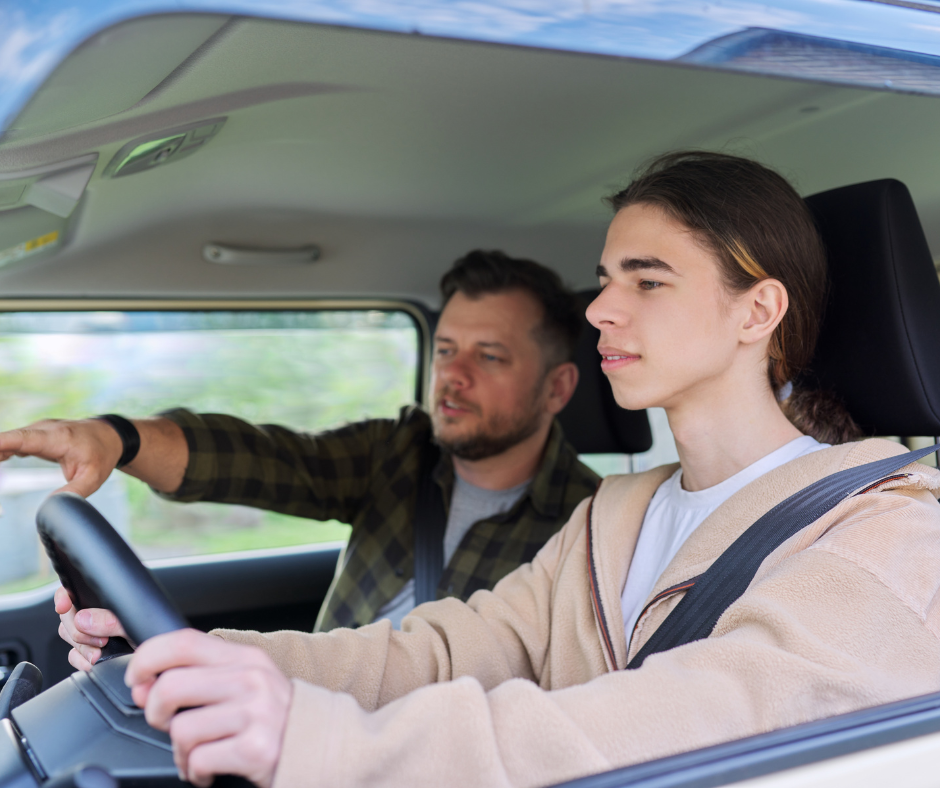 Father in the passenger seat teaching his teen to drive, an important milestone requiring a Spokane auto insurance review.
